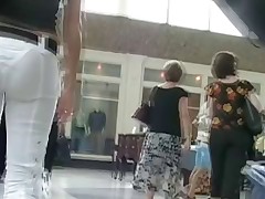 I was following this chick for rather a long time shooting her jeans ass in tiny thong