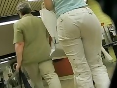 Wrapped in denim hot pants the butt cheeks of this girl sexily move when shes walking